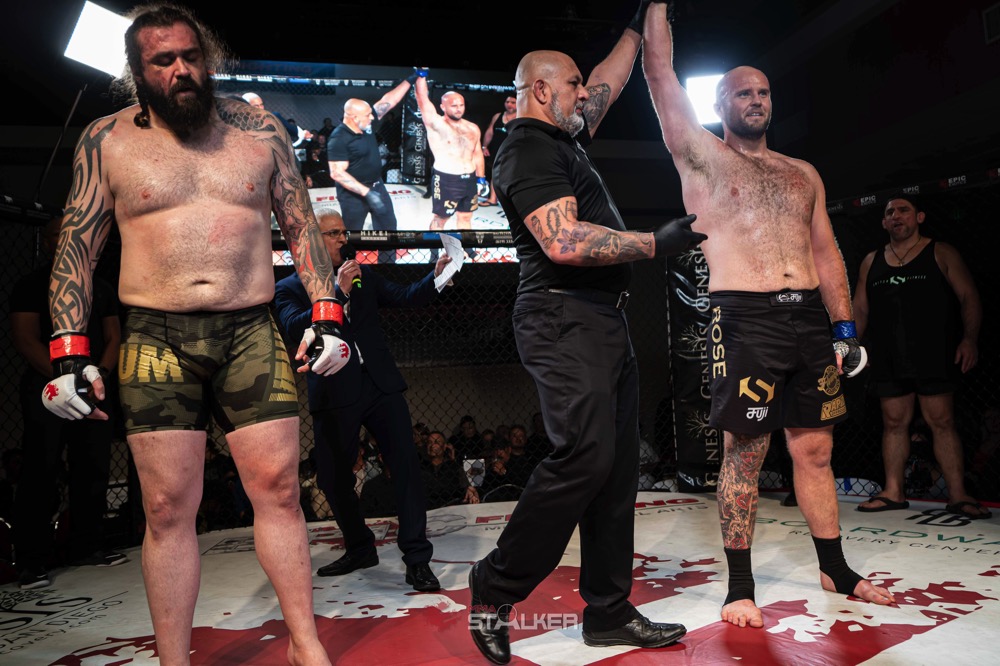 An amateur MMA bout in the cage.